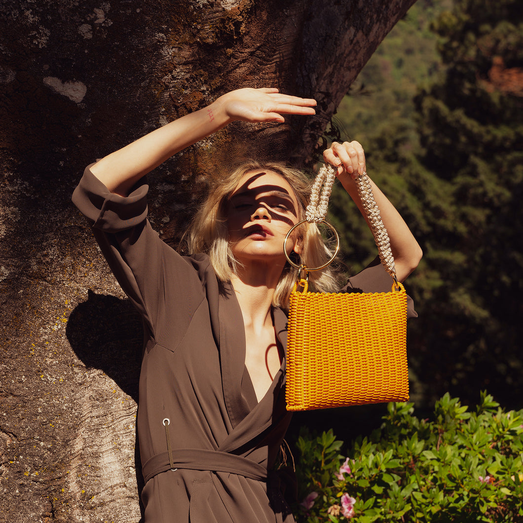 THE CIRCLE KNOTTED CLUTCH TURMERIC